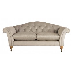 Pikowana sofa w pluszowej tkaninie